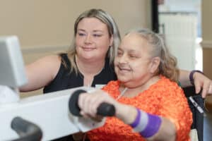A rehab therapist with a resident at Crystal Ridge Care Center