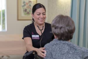 A caregiver with a resident at Crystal Ridge Care Center