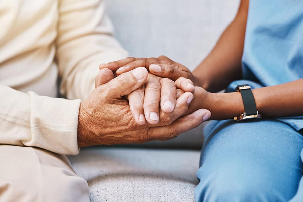 Nurse, hands and senior patient in empathy
