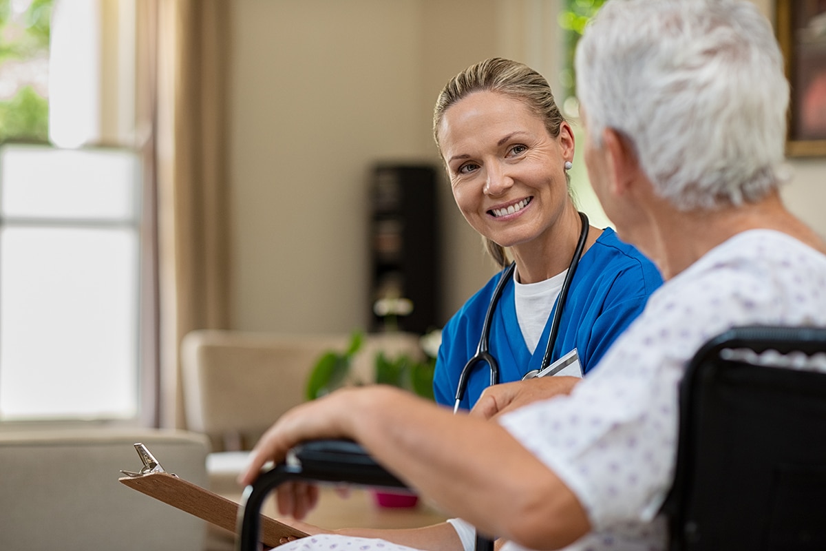 PACS-300x200-computer1 Friendly nurse talking to senior patient